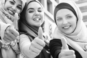 Group of islamic women gesturing thumps up