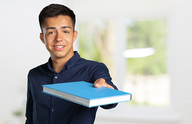 young student man with a book