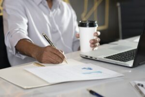 close-up-hand-writing-paper